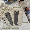 Calcetines para Mujer Songmu Estilo Primavera y Verano Lolita Moño Calcetines de Media Pantorrilla Estilo Japonés Algodón Arrugado