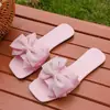 Pantuflas de mujer de talla grande con lazo, transfronterizas, en stock, nuevo modelo de verano, estilo europeo y americano, sandalias planas de punta cuadrada abiertas
