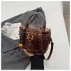 Bolsas de Cosméticos de Nuevo Estilo al por Mayor Transfronterizas, Bolsos de Mano Pequeños Estilo Chanel Retro, Bolsos de Hombro Cruzados Elegantes de Color Sólido de Nicho para Mujer