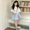 Conjunto de Camiseta de Encaje de Manga Corta y Falda Tutú para Niñas Estilo Verano 2026 para Niños Mayores Dulce Top de Dibujos Animados y Falda Corta