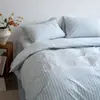 Juego de cuatro piezas de algodón puro a rayas estilo japonés, juego de sábanas y fundas de edredón 100% algodón modelo nuevo 2026, juego de tres piezas para ropa de cama de dormitorio estudiantil