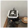 Atacado mochila fofa estilo menina com estampa de bolinhas, desenho animado e renda, nova popular para trabalho e deslocamento