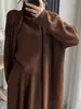 Conjunto de Tres Piezas de Punto de Longitud Media Estilo Coreano Otoño e Invierno Suéter de Cuello Alto de Alta Gama Cardigan Falda Traje Transfronterizo para Mujer