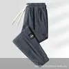 Pantalones casuales de otoño transfronterizos para hombre, corte holgado extragrande, estilo jogger versátil, cómodos para el trabajo y el deporte, pantalones largos