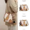 Bolso de Piel Genuina para Mujer 2026 Otoño e Invierno Nuevo Diseño de Nicho Bolso Cruzado Versátil Bolso Cubo de Gama Alta Equipaje