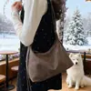 Versão Coreana Bolsa de Bolinho Nicho Retrô Bolsa de Ombro Transversal para Commuter para Mulheres 2025 Nova Bolsa Tote de Mão Moda Retrô