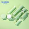 Botella de crema acrílica personalizada Xumin Green de 50 g y PP, frasco de crema facial de 30 ml, botella de vacío reemplazable.
