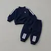 Nuevo Conjunto para Niños 2026 Otoño Nuevo Bebé Dibujos Animados Ropa Deportiva Conjunto de Dos Piezas Celebridad de Internet Niños Pequeños y Medianos Conjunto de Sudadera con Capucha