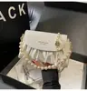 Bolso de Mano de Perlas de Nicho Nuevo Primavera 2026 con Acabado de Alta Gama, Bolso de Hombro con Cadena, Bolso Cruzado de Moda para el Trabajo