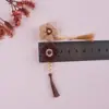 Material hecho a mano tejido flor borla accesorios para cabello largo aretes pinza para el cabello accesorios al por mayor flor de lana DIY
