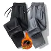 Calça casual masculina 2024 outono e inverno nova forrada com fleece espessa estilo coreano bolso na ponta do pé zíper calça plus size geração