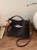 Bolsa Pequena Retro de Alta Qualidade para Uso Diário Transfronteiriça Feminina 2026 Nova Versátil Bolsa Transversal Bolsa de Mão Super Quente Bolsa para Mãe e Filho