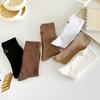 Medias color té con leche suaves tacón elegante bordado pequeño corazón niña calcetines hasta la pantorrilla ins calcetines apilables de celebridad de Internet al por mayor