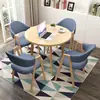 Conjunto de mesa e cadeiras para negociação loja comercial recepção reunião mesa redonda pequena área de descanso simples casual uma mesa quatro cadeiras mesa de jantar