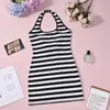 12035 Ropa de mujer transfronteriza europea y americana sexy sin espalda con cordones falda bodycon de chica caliente vestido de punto a rayas con cuello halter para mujer