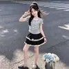 Conjunto de Verano Moderno 2026: Nuevo Conjunto Dulce de Dos Piezas con Camiseta de Manga Corta y Falda en Capas con Borde de Encaje
