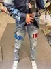 Jeans de alta gama estilo americano para jóvenes, rotos, corte ajustado skinny con elasticidad y parches, pantalones largos casuales