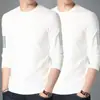 Camiseta elástica de manga larga para hombre, corte holgado, adecuada para primavera y otoño, color liso, versátil, se puede usar como atuendo de pareja, capa interior para hombre