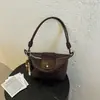 Bolso tejido con patrón transfronterizo para mujer, nuevo bolso tipo cubo de gran capacidad, bolso de hombro versátil y moderno para llevar debajo del brazo