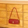 Bolso de axila de nicho de alta gama estilo coreano, bolso de mano versátil chic vintage, bolso baguette simple personalizado para el día a día