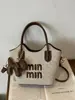 Bolsas de Mujer Transfronterizas 2026 Nueva Moda Tendencia Bolso Cubo de Paja con Letras Versátil Bolso de Hombro y Cruzado para la Playa
