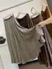 Elegante falda plisada de cintura alta estilo retro para mujer, nuevo estilo de principios de otoño 2026, falda plisada de línea A adelgazante y elegante con un dobladillo grande