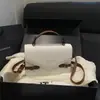 Bolso de mano cuadrado pequeño estilo coreano de alta gama transfronterizo, nuevo bolso de hombro de moda, elegante y simple, bolso cruzado versátil