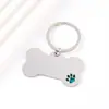 Colgante de pata de perro para mascotas transfronterizo con diseño de goteo de aceite, material en blanco de acero inoxidable, placa de identificación de perro de hueso grabada con láser, llavero de metal