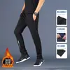Envio RápidoCalça masculina com forro de fleece para o inverno, com zíper lateral, múltiplos bolsos, cintura alta elástica, modelagem solta, calça de moletom, calça esportiva