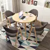 Conjunto de mesa e cadeiras para negociação loja comercial recepção reunião mesa redonda pequena área de descanso simples casual uma mesa quatro cadeiras mesa de jantar