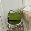 Elegante y chic bolso de mano tipo dumpling para mujer, nuevo modelo otoño e invierno 2026, patchwork de estampado de leopardo de lujo ligero para uso diario, bolso de hombro y cruzado
