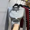 Chaqueta cárdigan de punto con cuello polo blanco para mujer, nuevo estilo otoño e invierno 2026, top interior adelgazante
