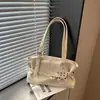 Coleção de outono 2026 transfronteiriça: bolsa tote de design exclusivo, grande capacidade, moderna e casual, com textura única e design estiloso, bolsa de ombro feminina