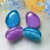 Nuevo y lindo peine mini portátil transfronterizo color macarrón cielo estrellado color huevo cabeza de masaje con airbag masajeador al por mayor directo de fábrica