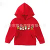 Sudadera con capucha para niños de comercio exterior, nuevo color liso con estampado de letras navideñas, suéter con capucha para niños de primavera y otoño, popular en Europa y Estados Unidos