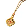 Joyería de colgante tradicional de trébol de cuatro hojas giratorio bañado en oro y con incrustaciones de diamantes, colgante de vajra de doble cara con incrustaciones de diamantes de nuevo estilo chino al por mayor