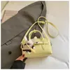 Bolso de mano Boston súper popular para mujer de primavera y verano 2026 nuevo bolso cruzado versátil bolso tote pequeño para el trabajo bolso tipo almohada