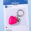 Llavero de corazón de resina de color dopamina estilo ins transfronterizo con anillo de resorte de aleación colgante de accesorio DIY al por mayor