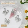 Nuevas joyas para uñas al por mayor lazo brillante hueco ojo de gato tridimensional combinan con todo para usar accesorios de decoración de uñas