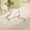 Pendientes de cadena Yixuan con cuatro circones, hilo para oreja con borla de strass súper brillante de nicho, estilo largo con un toque de alta gama