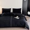 Juego de cuatro piezas de algodón lavado con agua de alta calidad de estilo japonés, edredón de algodón puro negro, sábana y gorro de cama, ropa de cama