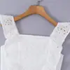 Falda corta abullonada de moda nicho estilo europeo y americano, vestido femenino ajustado que ciñe la cintura, bordado calado con mangas volantes pequeñas
