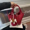 Bolso de Mano Pequeño con Patrón de Lichi Transfronterizo Primavera 2026 Nuevo de Moda Casual Cubo Versátil Bolso de Hombro Cruzado