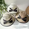 Sombrero femenino verano estilo coreano lazo grande sombrero de paja de playa viaje vacaciones protección solar sombrero para el sol sombrero de paja tejido estilo Chanel tipo cubo
