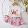 Conjunto Casual Desenho Animado para Meninas Verão 2024 Nova Moda Estiloso Bebê Manga Curta Top Saia Conjunto de Duas Peças