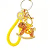 Llavero de coche pony bañado en oro con incrustaciones de diamantes de moda, colgante para bolso de mujer, llavero, regalo de empresa, aleación de zinc, lleno de diamantes