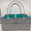 Bolsa de pañales de fieltro transfronteriza bolsa de almacenamiento de fieltro bolsa de gran capacidad almacenamiento de cosméticos bolsa organizadora fabricantes stock
