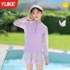 Traje de baño para niñas 2026 Nuevo estilo Niñas pequeñas y niños mayores Estilo falda dividida Manga larga Protección solar Secado rápido Traje de baño