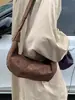 Otoño Invierno Retro Gamuza Cuerno Bolso Mujer 2026 Nuevo Casual Correa Ancha al Hombro Bolso Cruzado de Hombro Único Bolso de Sillín Coreano