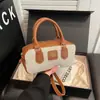 Bolsa Bowling de Cor Contrastante de Nicho Feminina 2025 Nova Bolsa de Mão de Lona de Alta Qualidade Bolsa Transversal de Ombro Retrô